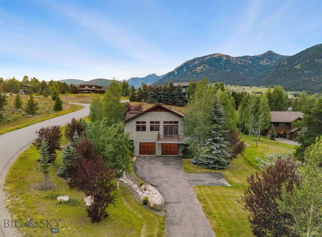 This beautifully maintained 3-bedroom, 2.5-bathroom home sits on a private and lushly landscaped .45 acre lot just steps from Big Sky’s vibrant Town Center. With 2,520 square feet of thoughtfully designed living space, this property offers both serenity and convenience—enjoy peaceful privacy while being within easy walking distance to Big Sky's farmer’s markets, summer concerts, restaurants, shops, and more.
From your back deck, take in the sights and sounds of Big Sky’s seasonal festivities without ever leaving home. The mature landscaping creates a park-like setting, and the home itself has been lovingly cared for and is in pristine condition—ready for its next chapter.
Whether you're looking for a full-time residence or a Big Sky retreat, 2130 Looking Glass offers the perfect balance of location, comfort, and charm.