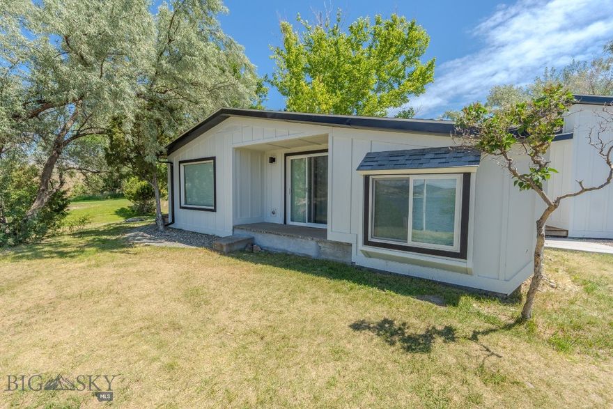 For those of you who know what opportunity looks like, you have a small off-season window to make a MOFIR on this little beauty. Sitting on just over a half acre of the East Shore of Canyon Ferry Lake and Reservoir, you'll find this FULLY RENOVATED single level home finished in a clean, bright color palette. The home features a retro fireplace, wood stove and generous windows allowing incredible light and views for miles. An ADORABLE Guest Bunk House sleeps up to six and will keep everyone snug as a bug. The additional RV Parking makes hosting a breeze with space for up to two units. Arguably one of the most attractive features is the Boat House overlooking endless sunsets, beachy shorelines, and waterfront access. Let the sun pour in the windows while you sip from your cup watching the lake come alive through the seasons. Everyone at the lake knows the BIGGEST DAY OF THE YEAR is the Fourth of July firework boat-parade, and you will have front row seats.  

This property includes a rare and attractive concrete boat ramp and durable metal dock system. With over 35,000 water surface acres, and 9,000 acres of shoreline, the lake offers excellent fishing opportunity for rainbow trout and walleye. Located just a short drive to Kim’s Marina and Yacht Club, The Norwegian Golf Course and Highlander Restaurant, and Helena’s infamous Gulches for exploration. This is a four season lake featuring capacity for all water sport enthusiasts.