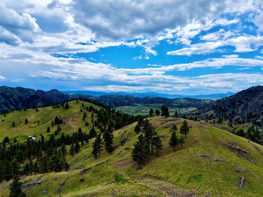 Perched high above the rugged beauty of Montana’s Dearborn River country, this remarkable mountain property offers the kind of peace and solitude that’s becoming harder to find. Surrounded by sweeping views of the Adel Mountains and endless Big Sky horizons, the land invites you to slow down, breathe deeply, and reconnect with the natural world. Build a mountain residence or a vacation cabin retreat to take in panoramic views stretching across rolling ridgelines, forested draws, and distant river valleys. From the top of the property, cell service allows you to stay connected when needed—while still enjoying the feeling of being worlds away from everyday life. Nature lovers and outdoor enthusiasts will feel right at home here. Wildlife is abundant throughout the area, with frequent sightings of mule deer, white-tailed deer, elk, moose, bighorn sheep, bobcats, soaring eagles, and countless bird species. The sounds of rustling pines, singing birds, and mountain breezes create a peaceful backdrop year-round. Adventure begins right outside your door. A hidden waterfall tucked behind the property can be reached by hiking through the surrounding terrain. Nearby recreational opportunities are endless—from hiking, horseback riding, ATV adventures, and camping to world-class fishing on the Missouri River and Dearborn River. Holter Lake, Craig, and the surrounding public lands offer exceptional boating, floating, hunting, and outdoor recreation in every season. As evening settles across the mountains, watch the changing light paint the ridges in gold and crimson while the stars emerge in astonishing clarity overhead. The mountains are calling!