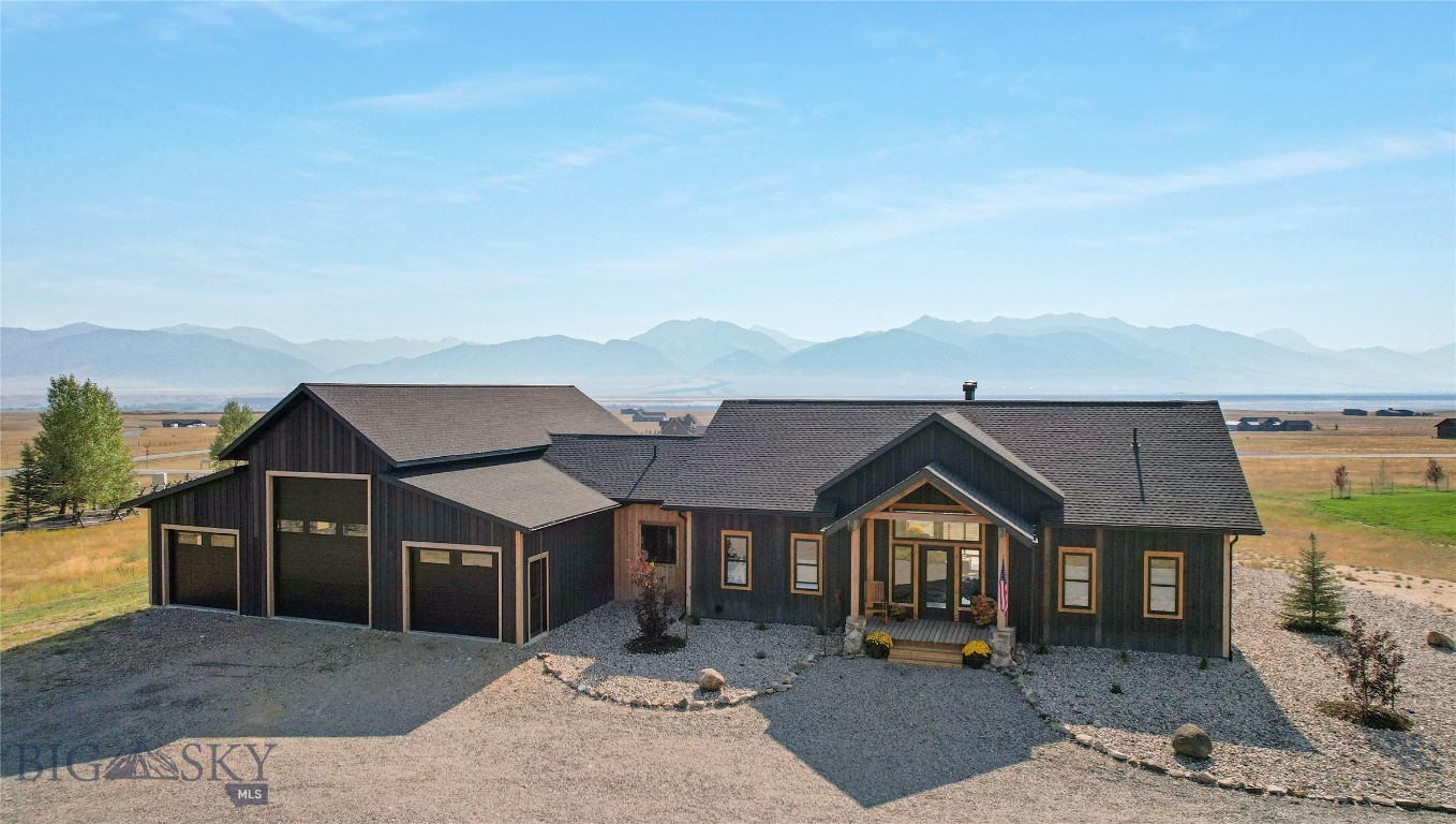 Incredibly unique custom home with 360 degree views of 3 mountain ranges (Madison Mountains, Gravelly Range and Tobacco Root Mountains). From the moment you step through the formal entry onto the hickory wood floors you are met with cathedral ceilings, open floor plan (living, dining, kitchen) huge windows, unique lighting, and a glimpse of the many artistic touches that will be found through this 4 bed-3.5 bath home. The kitchen has a large island topped with 3" broken edge leather granite, seeded glass fronted Showcase cabinets, and a big walk-in pantry. The Dining area has it's own entrance onto the wrap around deck where the outdoor kitchen-BBQ can be found. The Master Ensuite Bedroom also has it's own entrance onto the deck and the "Wet Room" has a custom shower, 5' soaker tub with a water fall, natural slate flooring and a big walk-in closet. Custom railing leads to the daylighted-walk out basement where you will find a second wood burning fireplace, 3 more bedrooms, and a kitchenette in the family room (ideal for guests or multi-generational living). The two basement bathrooms (1 full and 1 three quarter) are each graced with works of tile art as you will see a bear stepping from the Madison River, a Buffalo laying beside Old Faithful, and a moose. Attached to this incredible house you will find a 3+ bay garage with the middle bay door stretching to 12' wide x 14' high to house your camper/RV. Besides the 3 bays there are two more rooms - one a "SHOP" for your projects/fly-tying and the second could be the perfect craft room or additional storage. Artistic placement of the big windows bringing in views, Angela Harris Designer Tile throughout, Bryant Central Heating furnace with fresh air return, superior insulation, On Demand Navien Hotwater Maker, Wireless wall mount internet.....the list goes on and on and on - look in the supplements for the complete list of features. In Montana you don't just buy a property - you purchase a new lifestyle......this home and all of it's distinct features will create the haven you are searching for in this sometimes chaotic world. Come see it today!