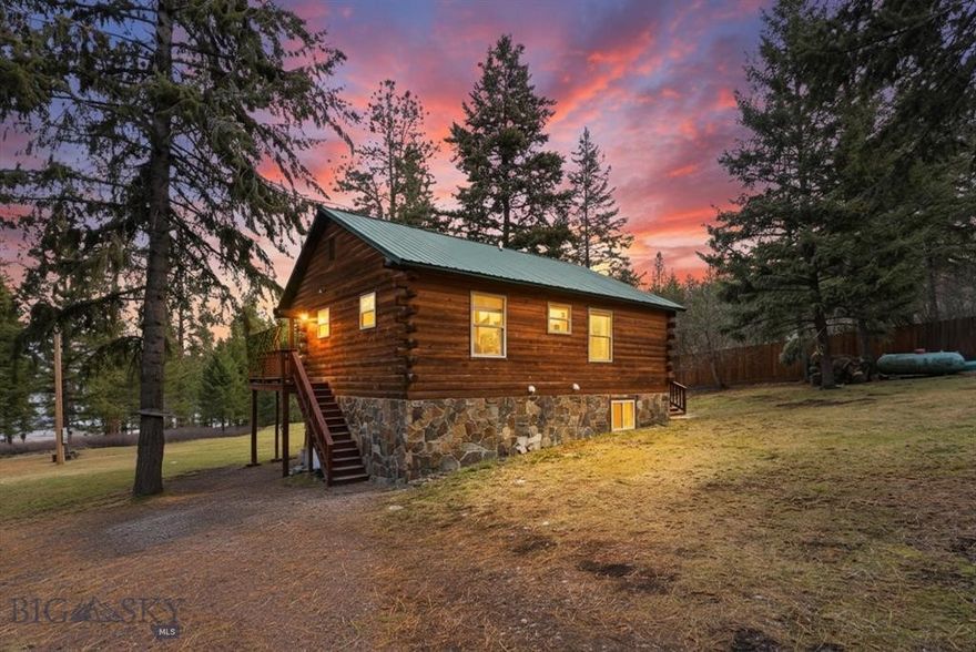 Well maintained log home on .75 acres less than 500 feet from Flathead Lake. The property has various trees and is partially fenced on two sides on a very private-feeling slope overlooking the lake. There is a lot of storage space throughout and nice sized closets for each of the three bedrooms with a healthy amount of light giving the space a bright and airy vibrance. The kitchen, living room, two bedrooms and a full bathroom are upstairs with full staircase leading to the downstairs where you will find a recreation room, utility room, and a bedroom with 3/4 bath. You can enter through the upstairs or downstairs. This home is easy to heat and cool with electric baseboards in the winter and window unit in summer, a cozy oasis in all seasons. The proximity to the lake and shared access with boat ramp and dock makes this property stand out, as well as being less than 15 minutes from Polson and under an hour to Kalispell. Great location with stunning views teeming with wildlife. Shared well with neighbor with agreement in place. Lake access as pictured, easy to find. Trees: Walnut, Apricot, Blue Spruce and Cedar and Lilac bushes.