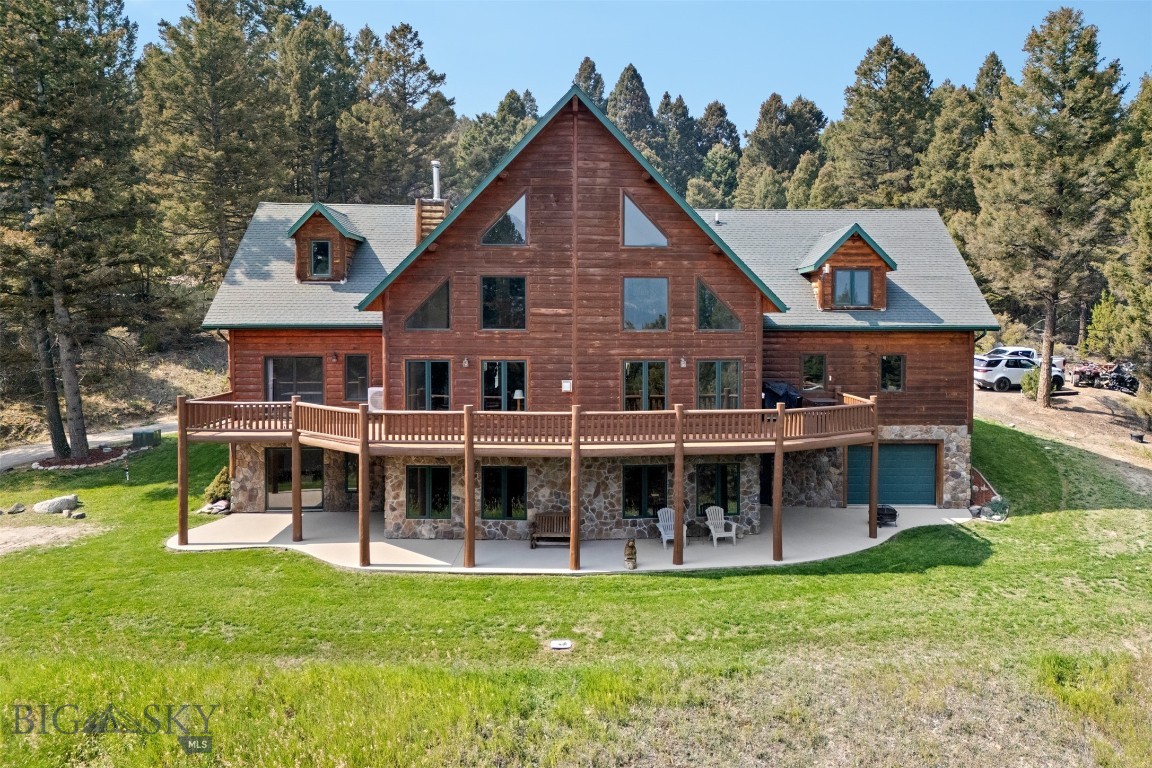 Just minutes from Butte, this stunning 5,916 sq. ft. custom-built home offers the perfect blend of Montana’s natural beauty and modern comfort. Set on 16.38 secluded acres, the property is surrounded by mature trees, dramatic rock outcroppings, and sweeping mountain views—creating a private sanctuary with a true sense of place.
Inside, the home features 5 spacious bedrooms, 3 bathrooms, a versatile office/den, and a bonus room that would make a perfect media room. The walk-out basement includes a full kitchen, ideal for hosting guests, extended family, or entertaining with ease.
The great room showcases soaring 28-foot ceilings with a striking rock fireplace as its centerpiece, complemented by finished log accents sourced from the property itself. Expansive windows and a wraparound deck invite you to take in the breathtaking views of the surrounding valley and peaks.
Additional highlights include:
Double-car attached 750 sq ft garage plus single door 750 sq ft garage for storage or workshop use
Landscaped yard with underground sprinklers
Seamless indoor-outdoor living with decks and gathering spaces
Large master bedroom with rock fireplace, en-suite bathroom featuring a jetted tub and walk in shower and a spacious closet
From its thoughtful design to its pristine setting, 2171 Janney Rd embodies the Montana lifestyle—where comfort, craftsmanship, and nature come together.