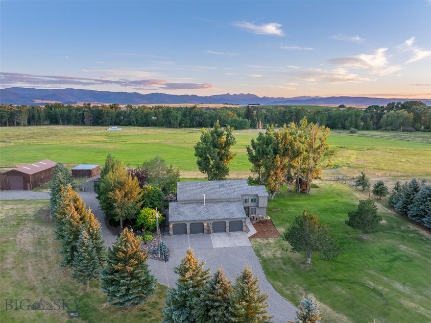 Set on nearly 22± pristine acres on the south side of Bozeman, this exceptional equestrian estate offers a rare blend of privacy, functionality, and sweeping panoramic views of the Hyalite and Spanish Peaks. Bordering a conservation easement along Middle Creek, the property provides both seclusion and direct access to the natural beauty that defines Montana living. A year-round creek and fully fenced pastures make this a turnkey opportunity for the discerning horse owner. The thoughtfully designed 4-bedroom, 3-bath home balances refined comfort with everyday livability. Warm, inviting interiors are anchored by a chef’s kitchen ideal for gathering, while expansive windows capture the surrounding landscape and create a seamless indoor-outdoor connection. A private, tree-lined patio offers a tranquil setting for relaxation or entertaining beneath big Montana skies. Equestrian amenities are both functional and well-appointed, including a six-stall barn with an attached shop, a dedicated hay barn, and a versatile three-sided barn suitable for additional shelter or equipment storage. Complementing the property is treehouse and a substantial 1,050± sq. ft. heated and finished four-car garage, ideal for trucks, trailers, gear, or a workshop space. With meticulously maintained grounds, established landscaping, and room to ride, this is a rare opportunity to own a fully equipped, equestrian retreat in one of Bozeman’s most sought-after settings—where lifestyle and land come together in perfect balance. No covenants and convenient access to Big Sky, the airport, local recreation and amenities.