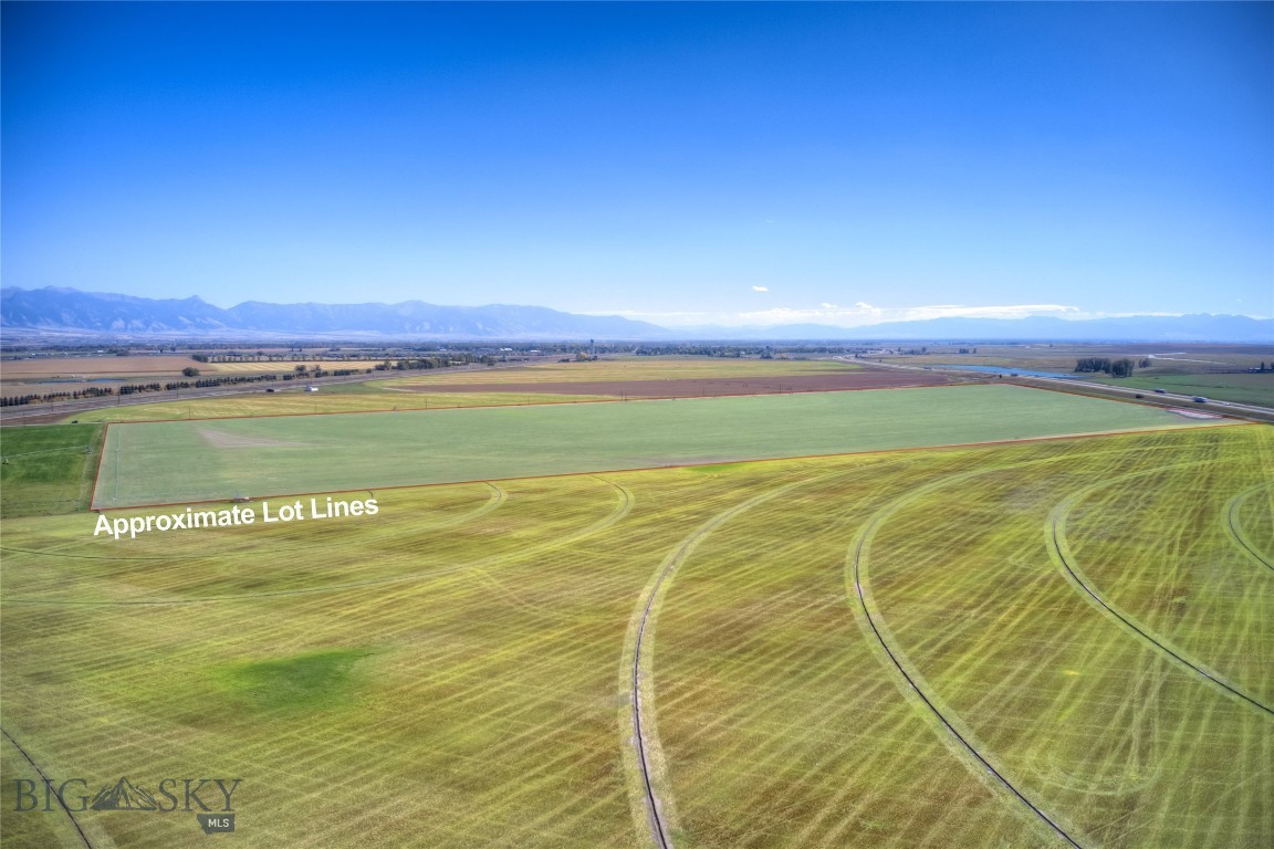 NO COVENANTS OR ZONING! Creative Seller - Bring your ideas!! 84+ beautiful acres of farm land just minutes outside of Manhattan. 360 degree views of the mountains and surrounding hillsides. Incredible opportunity for business and commercial use as well with I-90 frontage, and access to exits just a few minutes away. Great mountain views in all directions. Irrigation water rights, pivot and wheel line all convey. Property currently planted in alfalfa, leased by tenant farmer. *Disclosure: Listing Agent related to Seller.*