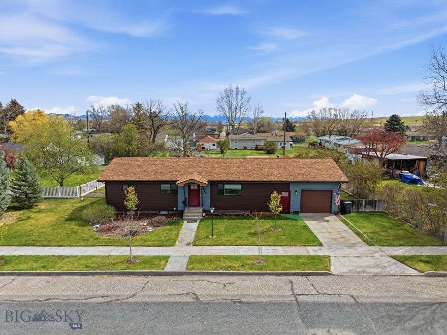 This is a rare opportunity to own a thoughtfully updated home with space, flexibility, and an unbeatable lifestyle.

Tucked into a quiet, established neighborhood on a spacious 0.321-acre lot with convenient alley access, this beautifully updated 3-bedroom, 2-bath home offers 2,026± square feet of comfortable living with room to grow. Blending classic charm with extensive modern upgrades completed between 2023–2025, this property is truly move-in ready.

The main level features a fully remodeled kitchen designed to impress, complete with custom soft-close cabinetry, quartz countertops, a functional island with added storage, and newer appliances. Original wood floors add warmth and character, while updated lighting, fresh paint, and additional insulation enhance both style and efficiency. The inviting living and dining areas provide great space for gathering, along with two generously sized bedrooms. The main-level bathroom has been tastefully updated with a walk-in tiled shower and sleek glass doors.

A practical breezeway connects key areas of the home, providing access to the attached one-car garage and the screened-in sun porch. From the kitchen, step directly out onto the large back deck—perfect for BBQs, entertaining, or simply relaxing while enjoying the beautifully landscaped yard. The outdoor space is complete with underground sprinklers, garden beds, and two storage sheds.

Downstairs, the basement level provides incredible flexibility with a large bonus space ideal for a master retreat, family room, game room, or home gym. You’ll also find a 3/4 bath, laundry room, ample storage, and a non-conforming bedroom.

Additional upgrades include new siding, exterior doors, high-efficiency furnace and central A/C, updated electrical service panel, a newer hot water heater and more...

Located just minutes from parks, schools, trails, and a public golf course, this home is perfectly positioned to enjoy all the outdoor recreation the area has to offer. Fish, boat, or float nearby ponds, and take advantage of the unique setting where the Madison, Jefferson, and Gallatin Rivers converge to form the Missouri River. Experience the best of small-town living with easy access to big Montana adventures.