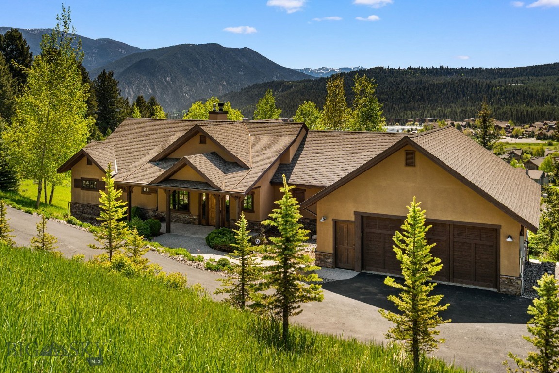 Welcome to this exceptional Big Sky mountain retreat located in the highly sought-after Sweet Grass Hills neighborhood. Perfectly situated on a quiet street ending in a peaceful cul-de-sac, this home offers a rare blend of privacy, views, and quick access to year-round adventure. Enjoy incredible southern sun exposure with breathtaking mountain views, while diverse wildlife — including elk, deer, moose, and even the occasional black bear — roam the serene surroundings. Outdoor enthusiasts will love the proximity to hiking and biking trails just minutes from the front door, and still minutes to Town Center and Big Sky Resort for world class skiing. Designed for effortless mountain living, the home features radiant in-floor heating and a fresh air exchange system for year-round comfort. The vaulted great room with a wood-burning fireplace creates a warm and inviting atmosphere, while the second living room with a pool table area and gas fireplace offers the perfect space to gather and unwind. Step outside to a covered and screened porch complete with a built-in heater and BBQ grill — ideal for enjoying the outdoors in every season. The spacious primary suite is a true retreat with a luxurious steam shower, while each of the three bedrooms features its own ensuite bathroom. An additional bunk room and dedicated office provide flexible space for family and guests. Practicality meets convenience with a two-car heated garage complete with a built-in dog wash — perfect for four-legged family members after a day on the trails.
Experience the best of mountain living in a quiet, coveted location with comfort, style, and nature at your doorstep.