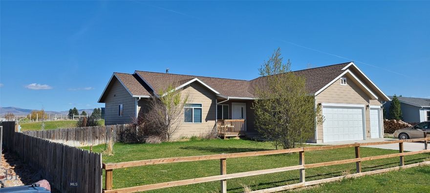 Nestled in a serene subdivision with breathtaking mountain vistas, this beautiful custom home is perched on a gorgeous lot at the end of the lane. This property offers the sought after blend of beauty, comfort, Big Sky views, all with the convenience of location! This gem is just a few miles from Downtown Dillon. The private community park is directly across the street for easy access, great line of sight, and fun year-round. Custom built in 2014, this home offers expansive views of the Sweetwater, East Pioneers, and Mt. Baldy. Interior highlights include recessed lighting, vaulted ceilings, bay windows, generous entryway, separate mud room and fully insulated 3 car attached garage. This 1628 sf home offers 3 bd, and 2 full ba w/ lots of room to customize it to your lifestyle and needs. The Primary suite features a large bay window with tranquil mountain views to wake up to, walk in closet, ensuite bathroom w/ double sinks, jetted tub, oversized tiled shower, and dedicated linen closet. This home's open concept design allows for great connectivity as you gather together with family & friends, enjoying the wood burning stove and gorgeous sweeping views of the Sweetwater Range. Hosting is a joy in this chef's kitchen w/ granite counters, stainless appliances, gas range & walk in pantry. Just off the kitchen is a mud room, separate laundry room, and interior garage door for easy unloading from inside the garage - great on those cold Montana days. Outside you have nearly half an acre with an expansive backyard, large deck and a hot tub, an ideal spot to soak in your property's incredible mountain views. If you are looking for that perfect balance of country living yet close to town, this home is one you don't want to miss!