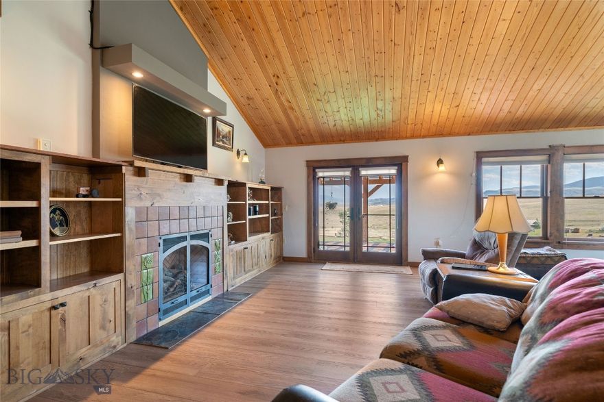Welcome to 35 Halo Loop in the scenic Shining Mountains Neighborhood of Ennis, Montana.  An exceptional property perched on 6.32 acres overlooking the Madison River Valley with sweeping views of Sphinx Mountain and the majestic Madison Range. This thoughtfully designed home features three well-appointed bedrooms and two bathrooms, blending comfort with functionality. The kitchen is a standout with granite countertops and luxury vinyl flooring, flowing seamlessly into the sun-filled great room. South-facing windows invite passive solar warmth during the winter months, complemented by radiant in-floor propane heat and a cozy wood stove for added comfort. The additional dwelling unit (ADU) offers a perfect space for guests, while outside the established lawn, garden, and greenhouse provide a lush and productive landscape. The oversized garage includes a heated workshop/man-cave, ideal for projects or relaxation, and a hot tub offers the perfect place to unwind while soaking in the stunning mountain views.
Located just 20 minutes from the charming town of Ennis and only an hour from Bozeman offering Yellowstone International Airport, this home offers both privacy and convenience. Outdoor enthusiasts will love the easy access to world-class Madison River fishing, mountain adventures, and private lake fishing at Haypress Lakes. Whether you're seeking a permanent residence or a recreational retreat, 35 Halo Loop offers a rare opportunity to enjoy the best of Montana living.