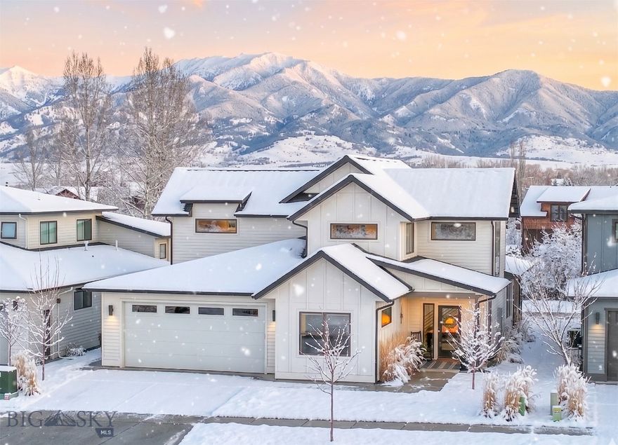 Park-side living in The Crossing, with trails out back and Gallatin Regional Park directly across the street. This thoughtfully designed Old Mill Homes residence offers ~2,800 sq ft, 4 bedrooms, 3 full baths, 3 car garage and a layout that lives beautifully: vaulted ceilings, upgraded windows, and an easy open flow between the kitchen, dining, and living spaces.

The kitchen anchors the home with quartz countertops, abundant cabinetry with under/over cabinet lighting, and a generous walk-in pantry with built-ins. The main-level primary suite is positioned for privacy and open-space connection, with direct patio access for seamless indoor-outdoor living. Upstairs you’ll find two additional bedrooms, a full bath, and a spacious loft that works as a second living area, office, or media space, finished with a striking custom metal railing.

A 3-car garage, central A/C, and excellent storage complete the package in a prime Bozeman location where park time and trail time are part of everyday life. (first snow image is ai edited)