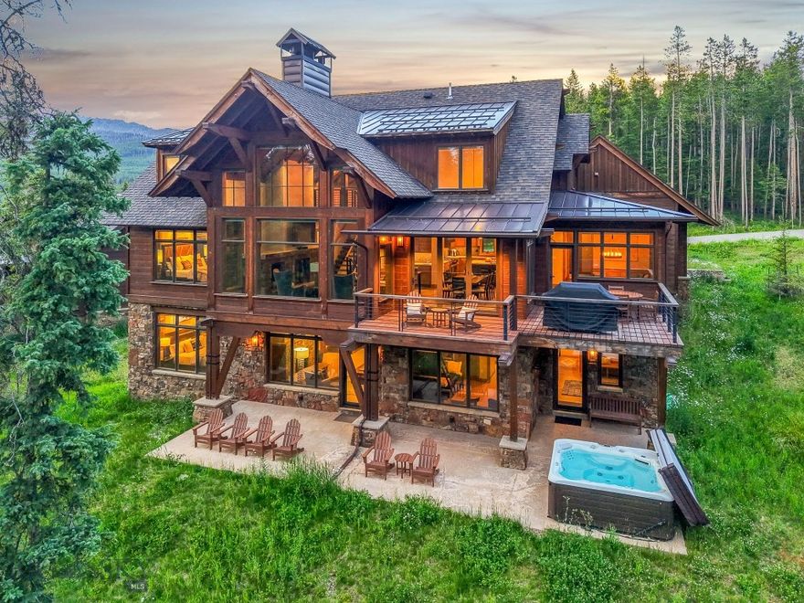 Luxury Ski-In/Ski-Out Retreat in Moonlight Basin, Big Sky, Montana:
Surrounded by a mature pine forest, this exceptional 5-bedroom residence is located in The Timbers, one of Moonlight Basin’s exclusive enclaves of single-family homes. Beautifully private and secluded, the home is also fully connected to all of Moonlight Basin via adjacent trails and open space. Perched directly on Stacey’s Way Ski Trail, you’re just a short glide to the Stagecoach Chairlift—offering the ultimate ski-in/ski-out access—and only minutes by foot or car to Moonlight Lodge, Ulery’s Lake Camp or Moonlight’s LakeLodge.
Crafted with heavy timbers, a floating staircase, and expansive windows that immerse you in nature, this luxury mountain home blends modern rustic architecture with timeless design. An open-concept kitchen flows seamlessly into the soaring two-story great room, anchored by a stone-clad gas fireplace and complemented by a large granite breakfast bar and sleek high-end appliances. A sunlit dining nook opens onto a generous deck and is perfect for outdoor living and serene wildlife viewing.
The main level features a stunning primary suite with floor-to-ceiling windows, calming forest and mountain views, a freestanding soaking tub, and a steam shower for a true spa-like experience.
Downstairs, the lower level offers its own retreat with a spacious family room with gas fireplace, wet bar and large wine refrigerator, a second deck, laundry room, and mudroom with ski storage and boot warmers. The family room on this level is the ideal gathering space for après-ski relaxation or entertaining.
The upper-level features two additional bedrooms connected by an open catwalk that overlooks the great room below, capturing aerial views from the vaulted ceilings.
Whether you're seeking solitude beneath the stars in the private hot tub or want to join in on the action at Moonlight Basin and Big Sky Resort, this property offers the best of both worlds—total tranquility with convenient access to world-class amenities. Just a short drive from the lively Mountain Village Plaza and an ideal basecamp for exploring Big Sky Country and Yellowstone National Park, this mountain retreat delivers luxury, comfort, and adventure in one unforgettable setting.