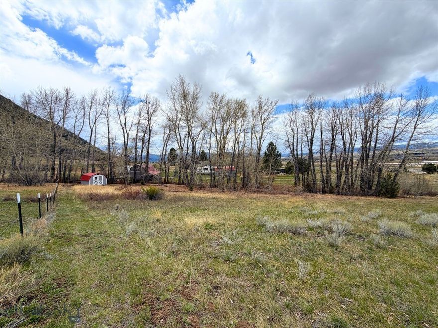This 3.89-acre property offers a rare blend of privacy, natural beauty, and convenience, with paved year-round access and essential infrastructure already in place, including power, a well with a hand pump installed. A scenic, year-round creek winds through the land, bordered by mature trees that create a tranquil, secluded setting, while multiple outbuildings provide flexible options for storage or agricultural use. The property is fully fenced and features a quaint Creekside structure ready for restoration, presenting a unique opportunity for customization. Enjoy the surrounding Mountains: Highlands, the Pintler Range, and the city lights of Uptown Butte, all while being just minutes from local amenities, including a nearby grocery store. With no covenants or HOA, low traffic, and direct access to public trails leading to the Continental Divide, this property is ideal for those seeking a peaceful retreat with exceptional recreational access and development potential.