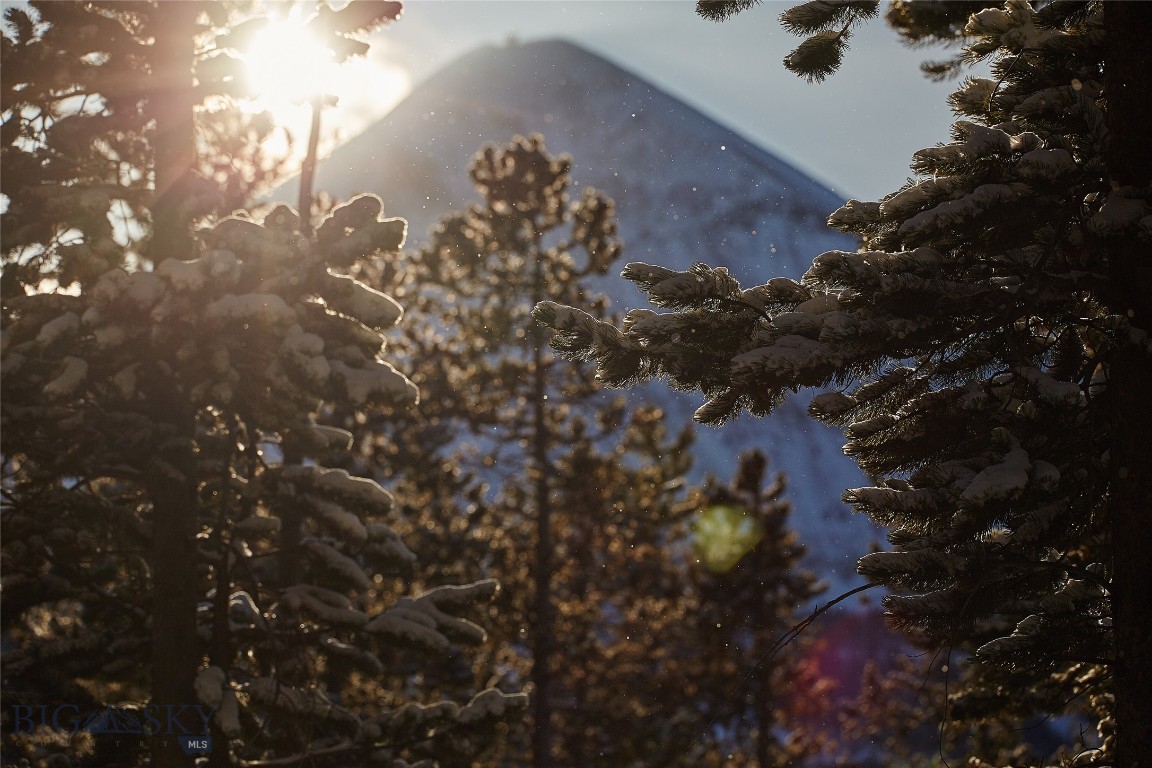 A truly rare offering in the heart of Moonlight Basin, this expansive 20-acre parcel combines privacy, natural beauty, and breathtaking mountain views—all within one of Montana’s most exclusive gated communities. Tucked among mature pine and aspen trees, the land offers a pristine setting for your dream home or legacy mountain retreat.
Enjoy panoramic vistas of the Lone Peak and surrounding wilderness from this parcel, with ample room to create a private sanctuary that blends seamlessly into the landscape. Surrounded by nature yet just minutes from world-class skiing, golf, and amenities, this property is a unique opportunity to own one of the most desirable areas in Moonlight Basin.
Whether you're envisioning a secluded getaway or a year-round residence, this is mountain living at its finest—peaceful, private, and incomparable.