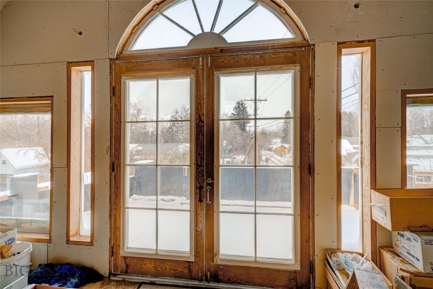 Located in the Heart of Downtown Bozeman, this remodeled and enlarged home presents an amazing opportunity for the new owner to finish & customize to create their dream property!! Designated as a single family dwelling it could be easily converted to a duplex... it's your call! The current owners have started the process and added creative & unique details that mimic the charm of its 1900's origin. Incredible vaulted ceilings, windows-light galore, 3 gas fireplaces, reclaimed wood flooring, archways, curves... second story balconies. Roughed in with 2 Bd/ 2 Ba. Walk to your favorite destinations & activities in our beautiful thriving city. A spacious covered car port provides ample off street parking. Invest in something totally different!! Reach out for a showing today!
**Property being sold unfinished & "as is".  Entire structure is framed in but needs both interior & exterior finishes completed. New Electrical/plumbing/HVAC on the main level of original structure and the new addition. Electrical on the 2nd story of addition requires completion. A list of included construction materials is provided in supplements.