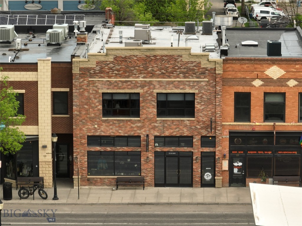 Exceptional office/retail space, ideally situated on the vibrant second level of 129 W Main Street. Revel in the character of this historic building, where wood flooring exudes warmth and sophistication, and original brick walls, along with tin ceiling tiles, not only enhance the aesthetic appeal but also pay homage to the building's rich history. At 1,056 square feet, this space offers an expansive open layout complemented by four enclosed offices, a convenient kitchenette, and a restroom. Positioned in the heart of downtown, this prime location sets the stage for your business to thrive. Don't miss the opportunity to make this uniquely charming space the home for your growing venture.