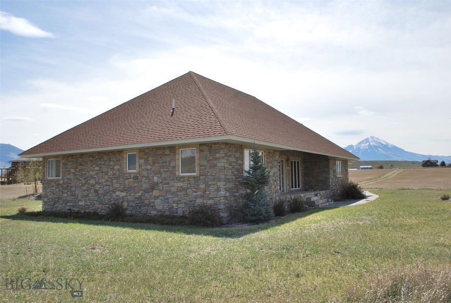 This beautiful home is a retreat on the Yellowstone River that was custom built with great attention to detail and has been meticulously cared for by the original owners who have only used it part time to get away and relax. This is the first time on the market for this property that sits on a 5.96 acre parcel at Blue Ribbon Manors in the heart of Paradise Valley with rare 343 feet Yellowstone River frontage. This home has 1,452 square feet of open living space featuring custom woodwork and beautiful stained glass transom windows above the doors. Interior flooring is slate and the heat system is a propane fired radiant floor system for great efficiency and warmth. The large 812 square foot attached garage is heated. This custom home has beautiful river rock siding with metal facias and soffits for a maintenance free exterior. There are also two open stone porches with over 400 square feet of additional living space, providing a great place to relax and take in the scenery with great views of the Absaroka and Gallatin mountain ranges and iconic Emigrant Peak. There are windows everywhere that flood the house with natural light and the views are spectacular.  The famous Yellowstone River is just steps away making short fishing walks as easy as it gets. The property is at a high enough elevation to be out of the FEMA flood zone. The access road is a well maintained gravel lane and provides good year around access. This property is just 20 minutes to downtown Livingston or about 30 minutes to the north entry of Yellowstone National Park. Chico Hot Springs, Sage Lodge and the Emigrant Saloon are about 10 minutes away for a hot springs dip or fine dining opportunities. There are thousands of acres of public lands within minutes of this property for hiking, camping or fishing the back country mountain lakes on Forest Service lands within the nearly one million acres of the Absaroka-Beartooth Wilderness area. If Paradise Valley is your preferred location you are going to want to check this place out. Call your agent today.