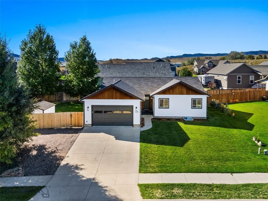 Welcome to this beautifully maintained and thoughtfully updated 4-bedroom, 3-bathroom home in the highly desirable Ridgeview Trails subdivision of Livingston, Montana. Perfectly situated just minutes from downtown and steps from scenic walking trails and the Northside Soccer Complex, this home offers the best of comfort, style, and Montana living.
Set on a spacious lot with mature trees, the front yard offers sweeping views of the majestic Absaroka Mountains. Inside, the home features a bright and open floor plan on the upper level, highlighted by vaulted ceilings, fresh interior paint, and brand-new vinyl plank flooring. The kitchen is both functional and stylish with sleek new countertops, stainless steel appliances, updated light fixtures, and a generous walk-in pantry. Sliding glass doors lead to a private patio perfect for outdoor dining, relaxing, or installing a hot tub.
The spacious primary suite includes new carpeting, a large walk-in closet, and a beautifully renovated en suite bathroom featuring new tile and a modern vanity. A second bedroom and another fully updated full bath complete the upper level.
Downstairs, you’ll find two additional large bedrooms, a third updated bathroom with matching new tile and vanity, a generous family room, and a separate laundry room—providing plenty of space for guests, a home office, or multi-generational living.
This home has seen extensive upgrades throughout, including new paint inside and out, stylish new light fixtures, newly tiled bathrooms, and renovated vanities that elevate each space. The attached two-car garage provides ample storage for vehicles and gear, while an additional parking area behind the fenced yard offers room for your camper or boat.
This move-in-ready home blends modern updates with timeless charm in one of Livingston’s most sought-after neighborhoods. Don’t miss your opportunity to make it yours—schedule a showing today!