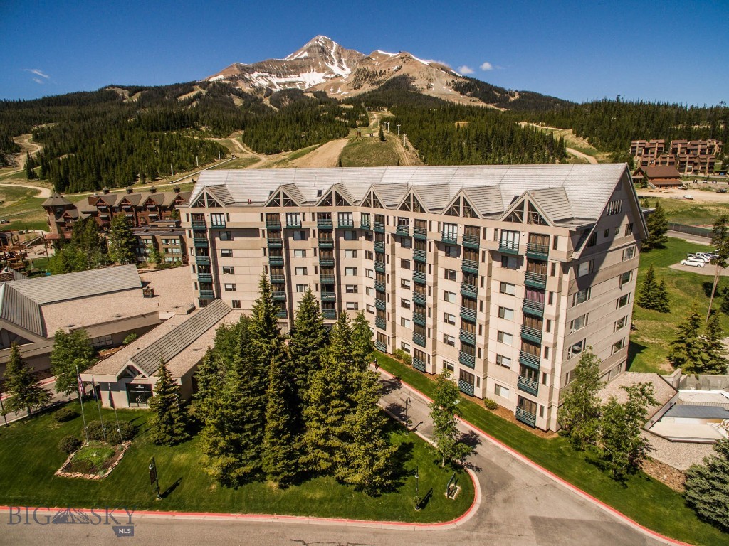 Welcome to your mountain escape in the heart of Big Sky! This beautifully situated 1BR/2BA condo on the 3rd floor of the Shoshone Condo Hotel offers stunning views of the trees and surrounding mountains—just steps from the slopes with true ski-in/ski-out access. Located at the base of Lone Peak in Big Sky Resort, this full-service condo-hotel puts you at the center of world-class skiing, hiking, biking, and mountain adventure.
The unit comfortably sleeps six with a private (king sized bed) bedroom, two full bathrooms, a Murphy bed, and a pull-out couch in the living room—perfect for families or guests. Enjoy a full kitchen, cozy fireplace, and the convenience of being fully furnished and rental-ready. Shoshone offers resort-style amenities including a heated pool, hot tub, sauna, fitness center, hair and nail salon, room service, and valet parking—ideal for relaxing after a day on the mountain. Whether you're looking for a personal getaway, vacation rental income, or both, this property is a solid investment in one of the most sought-after destinations in the Rockies. Big Sky is quickly becoming one of the premier year-round mountain resorts in the U.S., with the largest skiing terrain in America, a charming village, golf, fishing, and close proximity to Yellowstone National Park. Don’t miss your chance to own a piece of Big Sky magic!