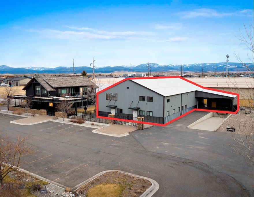 The warehouse component at 260 Ice Center Lane totals approximately 5,400 SF and is well suited for a range of commercial, industrial, manufacturing, storage, and distribution uses. The space includes dry and cold storage, a loading dock, mezzanine storage, washer/dryer hookups, and a bathroom, creating a functional layout for both operational and support needs. An approximately 500 SF carpeted second-floor office provides dedicated administrative space, while three phase power supports a variety of fabrication and light manufacturing applications. The warehouse is located within Commercial zoning, and also benefits from additional outdoor storage area. Centrally located to Bozeman, Belgrade, and Big Sky, the property offers convenient regional access.