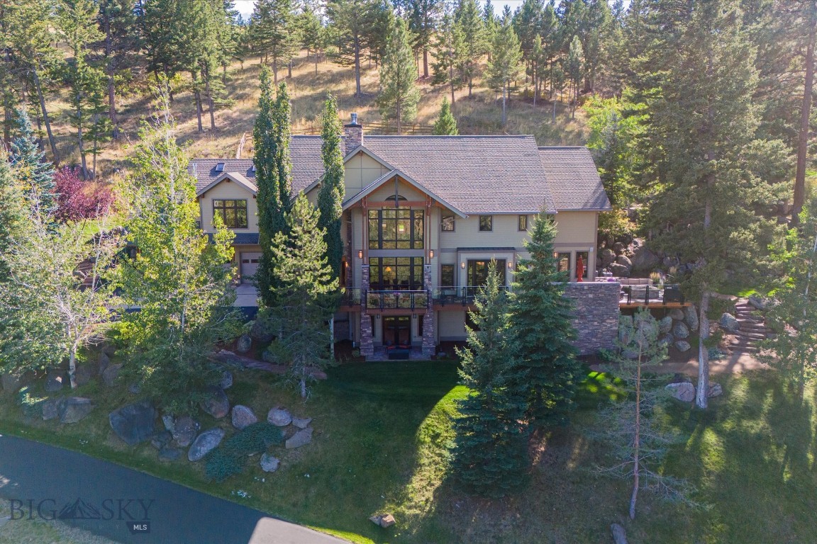 Discover your private Montana sanctuary on a sprawling 7.3-acre estate in the serene Montana City area. This exquisite timber frame home, crafted by the renowned Dowling Architecture and built by Abraham Construction, embodies rustic elegance and modern luxury.
Perched to offer breathtaking panoramas of the Helena Valley, the Sleeping Giant, and Lake Helena, the residence is a haven for nature lovers. The grand open floor plan features expansive floor-to-ceiling windows that bathe the interior in natural light, while a striking floor-to-ceiling fireplace serves as the focal point of the living space.
The gourmet kitchen is a chef's delight, seamlessly blending functionality and style. Step outside to the expansive deck, where you can savor the stunning views and the tranquility of your surroundings. The meticulously landscaped grounds feature rock formations, aspen trees, and boulders, all enhanced by a flowing water feature that creates a peaceful atmosphere.