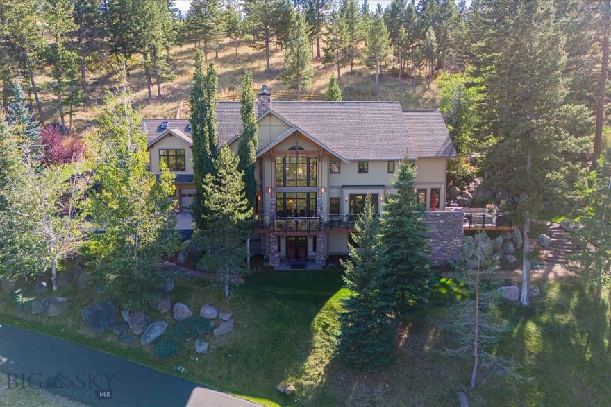 Discover your private Montana sanctuary on a sprawling 7.3-acre estate in the serene Montana City area. This exquisite timber frame home, crafted by the renowned Dowling Architecture and built by Abraham Construction, embodies rustic elegance and modern luxury.

Perched to offer breathtaking panoramas of the Helena Valley, the Sleeping Giant, and Lake Helena, the residence is a haven for nature lovers. The grand open floor plan features expansive floor-to-ceiling windows that bathe the interior in natural light, while a striking floor-to-ceiling fireplace serves as the focal point of the living space.

The gourmet kitchen is a chef's delight, seamlessly blending functionality and style. Step outside to the expansive deck, where you can savor the stunning views and the tranquility of your surroundings. The meticulously landscaped grounds feature rock formations, aspen trees, and boulders, all enhanced by a flowing water feature that creates a peaceful atmosphere.