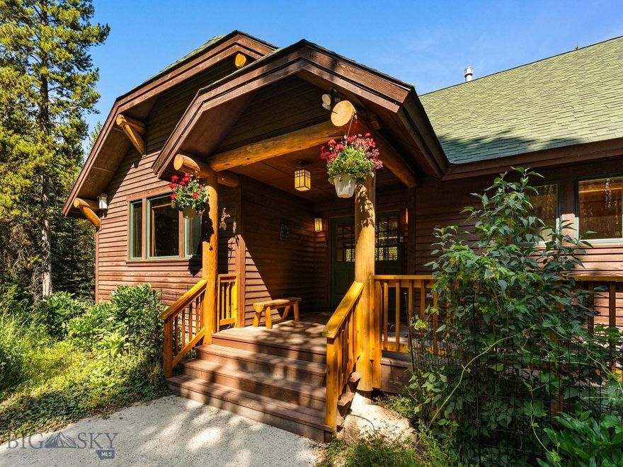 This custom residence in Aspen Groves offers four bedrooms, four and a half baths, and nearly an acre of privacy, just minutes from Town Center. Designed and meticulously maintained by its original owners, the home blends the warmth of mountain living with refined details and modern comforts.

The main level features vaulted ceilings with exposed wood trusses, a spacious chef’s kitchen with a large island and high-end appliances, and an open living and dining area anchored by a stone fireplace. A generous deck extends into the trees, creating a true sense of seclusion. The private primary suite includes a gas fireplace, spa-like bath with soaking tub and shower, and a walk-in closet. Thoughtfully placed off the heated two-car garage, the mudroom and laundry are ideal for the outdoor enthusiast who prefers to leave their adventures at the door rather than track them through the house.

The lower level offers three additional en suite bedrooms, each with walk-in closets, plus a dedicated office. One suite provides walk-out access to the outdoors, while tall ceilings and large windows keep the spaces bright and inviting.

Wildlife is a daily part of life here, with elk, moose, deer, and fox often wandering through the property. In winter, residents enjoy nearby cross-country trails and skiing, while in summer the deck is perfect for gathering with friends and soaking up the peaceful mountain setting. Offered partially furnished, this is more than a home—it’s a true Big Sky retreat that balances privacy with convenient access to everything town has to offer.