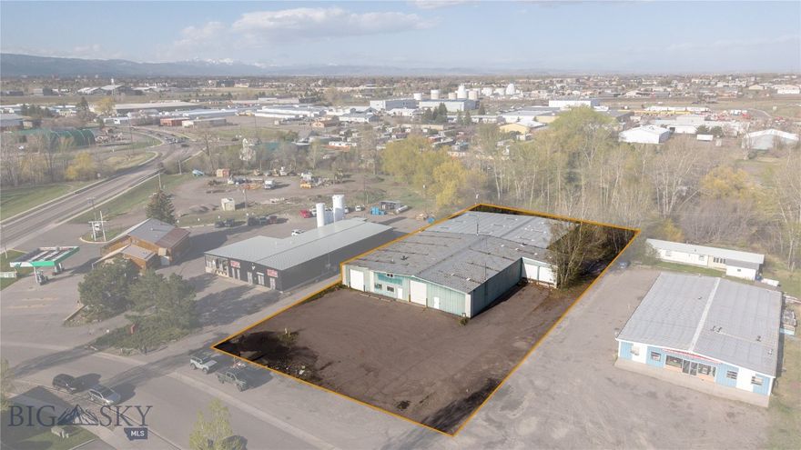 Hard to find large-scale industrial property for sale in Bozeman's northeast commercial neighborhood. Approximately 17k sq ft of flex industrial space is located on an acre. Ideal for industrial, storage, and manufacturing needs. Loading docks and a large parking lot. Multiple overhead doors, pull-through options, floor drains, small office. This property meets many large-scale industrial needs, this is a unique blank slate for all your business needs!