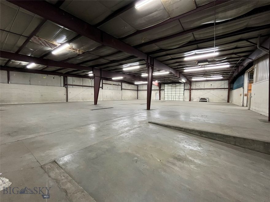 Hard to find large-scale industrial property for sale in Bozeman's northeast commercial neighborhood. Approximately 17k sq ft of flex industrial space is located on an acre. Ideal for industrial, storage, and manufacturing needs. Loading docks and a large parking lot. Multiple overhead doors, pull-through options, floor drains, small office. This property meets many large-scale industrial needs, this is a unique blank slate for all your business needs!