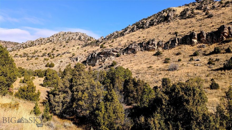 Here’s a rare opportunity to own pristine Montana land—never built on, never plowed, and ready for your vision. Spanning approximately 19.5 acres, this property represents one of the most compelling values for acreage in Gallatin County.  Several attractive building sites offer easy, year-round access and a peaceful sense of seclusion. The land also supports thriving wildlife habitat, with frequent sightings of deer and elk, along wide variety of bird species.  Positioned on the desirable lower terraces of Gallatin River Ranch—closer to both the river and town—the property benefits from direct access via a well-maintained county road, making it as practical as it is scenic.

Gallatin River Ranch is a sought-after development encompassing over 6,000 acres, known for its private access to two renowned rivers, an impressive equestrian center, more than 20 miles of trails and private roads, and over 1,600 acres of shared open space. It also lies within the highly regarded Manhattan School District.  Despite its tranquil setting, the property is conveniently located just 10 minutes from Manhattan, 20 minutes from Bozeman Yellowstone International Airport, and 30 minutes from Bozeman’s vibrant Main Street.

For buyers seeking space, privacy, and proximity in the greater Bozeman area, this property stands out. Schedule a private tour today.