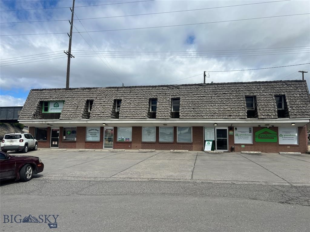 Multi-unit commercial property located on Butte's primary commercial street. This prime commercial location boasts high visibility and traffic count which translates into increased customer volume. The property's versatility allows the option to occupy some units for your business while leasing other units. Another option is an income-producing property for an investor. There are three units on the street level, all are currently leased. The building does have deferred maintenance. Ideal for both retail and office use. Plenty of off-street parking for customers and employees. In addition to the building, there is vacant land that has many potential commercial uses, it is currently leased to a neighboring tire business.