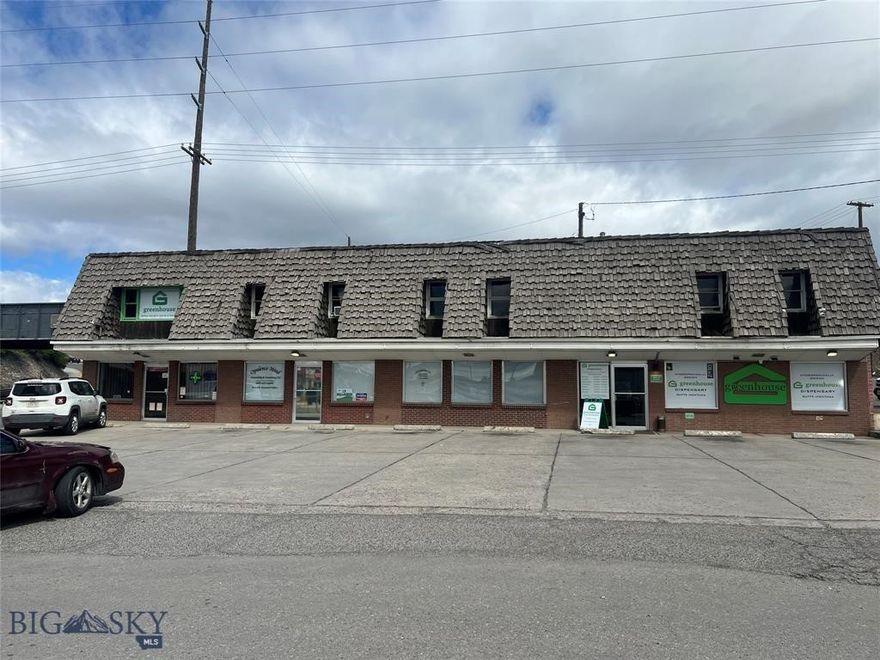 Multi-unit commercial property located on Butte's primary commercial street. This prime commercial location boasts high visibility and traffic count which translates into increased customer volume. The property's versatility allows the option to occupy some units for your business while leasing other units. Another option is an income-producing property for an investor. There are three units on the street level, all are currently leased. The building does have deferred maintenance. Ideal for both retail and office use. Plenty of off-street parking for customers and employees. In addition to the building, there is vacant land that has many potential commercial uses, it is currently leased to a neighboring tire business.