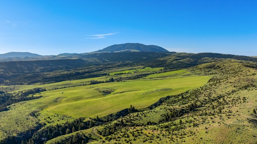 Looking for the perfect Montana hunting property to check your boxes? Under an hour to Bozeman? Check.
End-of-the-road solitude? Check. Expansive views stretching across Montana’s wild country? Check. Consistent
big game? Absolutely. A renovated off-grid cabin to anchor it all? Check. You could keep going, but the truth is
properties like this rarely come available, especially one located just 28 miles from the Bozeman airport and
under an hour from downtown. Spanning approximately 654 acres, this ranch offers a compelling blend of
diverse terrain, from timbered draws and sun-soaked ridges to over 200 acres of productive tillable ground well-
suited for food plots and habitat enhancement. Three natural springs, thoughtfully developed and associated stock
tanks, provide reliable water sources that support both livestock use and a strong, consistent wildlife presence.
The topography strikes a rare and highly desirable balance, varied enough to hold game year-round, yet open
enough to hunt effectively, allowing animals to feed, rut, and bed with a sense of security that keeps them
coming back to the ranch. Decades of successful harvests speak for themselves, with a proven track record of
quality and trophy mule deer, whitetail deer, elk, and other game species frequenting the ranch. Tucked at the
end of the road and surrounded by vast legacy ranches, the privacy here is genuine and increasingly difficult to
find. A renovated off-grid cabin lies in the most private corner of the property, simple, purposeful, and exactly
what it should be, offering the perfect place to unwind after a day on the land or temporary accommodations as
you build your dream cabin. The ranch is further protected by a conservation easement, preserving its peaceful
character and open landscape for generations to come. Very few properties of this caliber and location ever reach
the market, particularly in the highly sought-after foothills of the Bridger Mountain Range, making this a rare
opportunity to own a truly special piece of Montana that delivers seclusion, accessibility, and many sporting
endeavors without compromise.