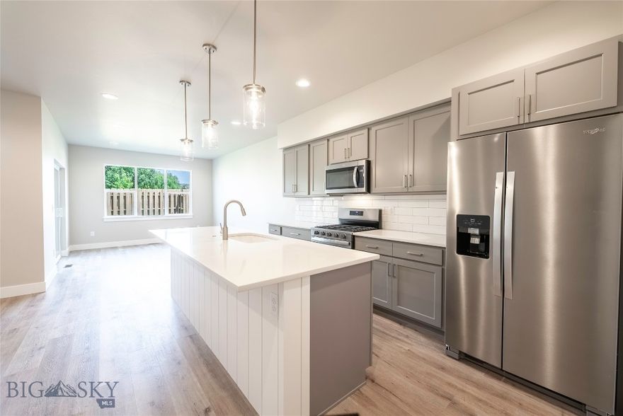 Welcome to this thoughtfully designed townhome blending modern style with everyday comfort. The main level welcomes you with an open-concept layout, where the kitchen, dining, and living areas flow seamlessly together. A covered patio extends your living space outdoors, ideal for morning coffee or evening gatherings. A convenient half bath completes the downstairs. Upstairs, a cozy nook offers a perfect space for reading or a home office setup. The primary suite features a private ensuite bath, walk-in closet, and private access to a covered balcony, your own personal retreat. A second bedroom, also with a walk-in closet, is located near a full bathroom and a dedicated laundry room for added convenience. Located in the sought-after Valley Meadows Subdivision, this home offers a stylish and functional design in a prime location, with easy access to parks, trails, and local amenities.