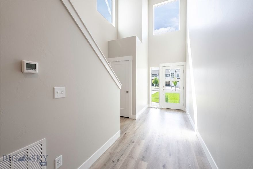 Welcome to this thoughtfully designed townhome blending modern style with everyday comfort. The main level welcomes you with an open-concept layout, where the kitchen, dining, and living areas flow seamlessly together. A covered patio extends your living space outdoors, ideal for morning coffee or evening gatherings. A convenient half bath completes the downstairs. Upstairs, a cozy nook offers a perfect space for reading or a home office setup. The primary suite features a private ensuite bath, walk-in closet, and private access to a covered balcony, your own personal retreat. A second bedroom, also with a walk-in closet, is located near a full bathroom and a dedicated laundry room for added convenience. Located in the sought-after Valley Meadows Subdivision, this home offers a stylish and functional design in a prime location, with easy access to parks, trails, and local amenities.