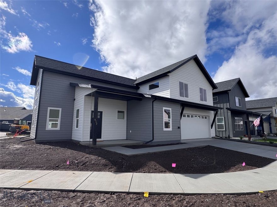 Built by Higher Standard Homes, this thoughtfully designed home sits on a premier corner lot, backing to open space and just steps from Askins Park that includes a pond with beach, amphitheater, soccer field, bike park, playground, dog park and pavilion. Inside, the layout is smart and functional with high ceilings in the living room that extend up to the second floor, and oversized windows that frame the Bridger Mountains and bring in tons of natural light. The kitchen features quartz counters, soft-close Belmont cabinets, a gas range, pantry, and extra counter space for prepping, baking, or serving. The dining area connects seamlessly to both the kitchen and living room, creating a comfortable flow. The main floor primary suite overlooks the backyard and the bathroom offers dual sinks and a soaking tub. Just off the mudroom, you’ll find a powder bath and a large laundry room with a utility sink. Upstairs, there are three additional bedrooms, a 3/4 bath, and a flexible loft area, perfect for a second living room, play space or office. Two of the bedrooms are tucked away on the other side of the loft, creating a nice separation of space. Outside, the backyard will be fully fenced and landscaped with underground sprinklers. A/C is also included! Located in Belgrade’s most exciting new development, West Post offers easy access to both downtown Bozeman and the airport, along with planned retail, parks, and miles of trails right outside your door. As part of this exciting mixed-use development, residents will have access to a wealth of amenities, parks, and trail systems. Embrace the spirit of community and enjoy the convenience of having everything you need right at your doorstep. Located just south of I-90 and the Bozeman Yellowstone International Airport, West Post offers easy access to both Belgrade and Bozeman. Whether you're commuting for work or exploring the great outdoors, this prime location puts you in the center of it all. This is the only home with this floor plan in the entire neighborhood, don’t miss the chance to make it yours.