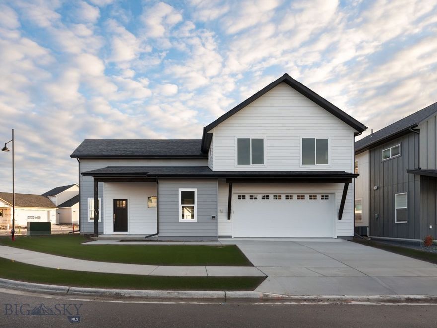 Built by Higher Standard Homes, this thoughtfully designed home sits on a premier corner lot, backing to open space and just steps from Askins Park that includes a pond with beach, amphitheater, soccer field, bike park, playground, dog park and pavilion. Inside, the layout is smart and functional with high ceilings in the living room that extend up to the second floor, and oversized windows that frame the Bridger Mountains and bring in tons of natural light. The kitchen features quartz counters, soft-close Belmont cabinets, a gas range, pantry, and extra counter space for prepping, baking, or serving. The dining area connects seamlessly to both the kitchen and living room, creating a comfortable flow. The main floor primary suite overlooks the backyard and the bathroom offers dual sinks and a soaking tub. Just off the mudroom, you’ll find a powder bath and a large laundry room with a utility sink. Upstairs, there are three additional bedrooms, a 3/4 bath, and a flexible loft area, perfect for a second living room, play space or office. Two of the bedrooms are tucked away on the other side of the loft, creating a nice separation of space. Outside, the backyard will be fully fenced and landscaped with underground sprinklers. A/C is also included! Located in Belgrade’s most exciting new development, West Post offers easy access to both downtown Bozeman and the airport, along with planned retail, parks, and miles of trails right outside your door. As part of this exciting mixed-use development, residents will have access to a wealth of amenities, parks, and trail systems. Embrace the spirit of community and enjoy the convenience of having everything you need right at your doorstep. Located just south of I-90 and the Bozeman Yellowstone International Airport, West Post offers easy access to both Belgrade and Bozeman. Whether you're commuting for work or exploring the great outdoors, this prime location puts you in the center of it all. This is the only home with this floor plan in the entire neighborhood, don’t miss the chance to make it yours.