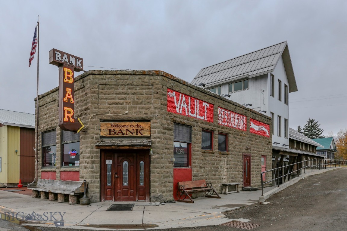 The Historic Bank Bar & Vault Restaurant! Featured on "America's Best Restaurants in 2024'  This Turn Key Business Opportunity includes Liquor, Catering and Gaming License. Originally established as a bank, this iconic building has been transformed into the popular bar that remains today. A beloved community gathering spot with a rich heritage. Built in the early 1900's, the Bank Bar has preserved its distinctive architectural features, including original brickwork, high ceilings and classic bank attributes that add to the character and charm. Over 5600 square feet of commercial space, consisting of  multiple levels including bar area, family dining space, kitchen and office space and much more. Situated in the heart of scenic Wilsall on the main highway, this property benefits from a central location that attracts both locals and tourists passing through this beautiful part of Montana! Whether you're interested in continuing the legacy of the popular Bank Bar or reimaging the space for your own business, this property is ready for your next venture!