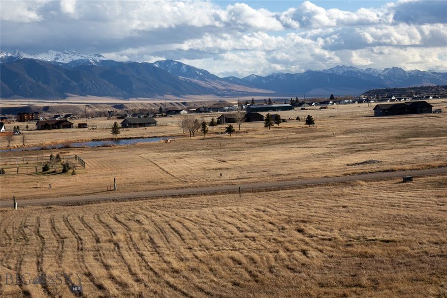 This 1.44-acre lot is ready for your new build in the desirable Sky View subdivision. The property overlooks the community pond and enjoys wide-open views of the Madison Range, including Fan Mountain. Sky View is connected to the town of Ennis and the K–12 school (Home of the Mustangs) by paved pedestrian and bike trails, providing easy access to town amenities while maintaining a peaceful setting. Residents enjoy a quiet, well-kept neighborhood with direct trail access to Madison Meadows Golf Course—drive your cart straight to the clubhouse. Conveniently located just minutes from the grocery store, hardware store, and downtown Ennis.