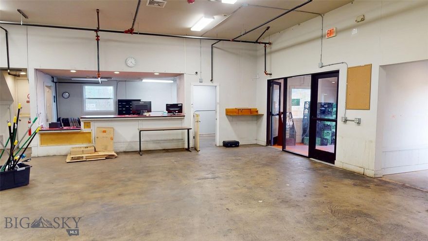 Large commercial building in convenient location just off the North 7th Exit of I-90.  Area is currently home to several hotels and restaurants, and new projects to the north include a new hotel, Simkins-Hallin, and several other users in the new North Loop development.  Primarily open layout lends itself to a variety of uses and allows for cost effective customization.  Building was originally built as an entertainment center, operated as a large daycare for 20 years and most recently occupied by HRDC.  Floorplan and site layout make this a great building for daycare, church, gym, retail, restaurant and many other similar uses.  Current layout has a check-in counter up front, and a large bank of men's and women's restrooms and showers in the rear.  40+ windows around the perimeter of the space create light throughout the entire building.  Building is also available for lease at MLS# 404437.