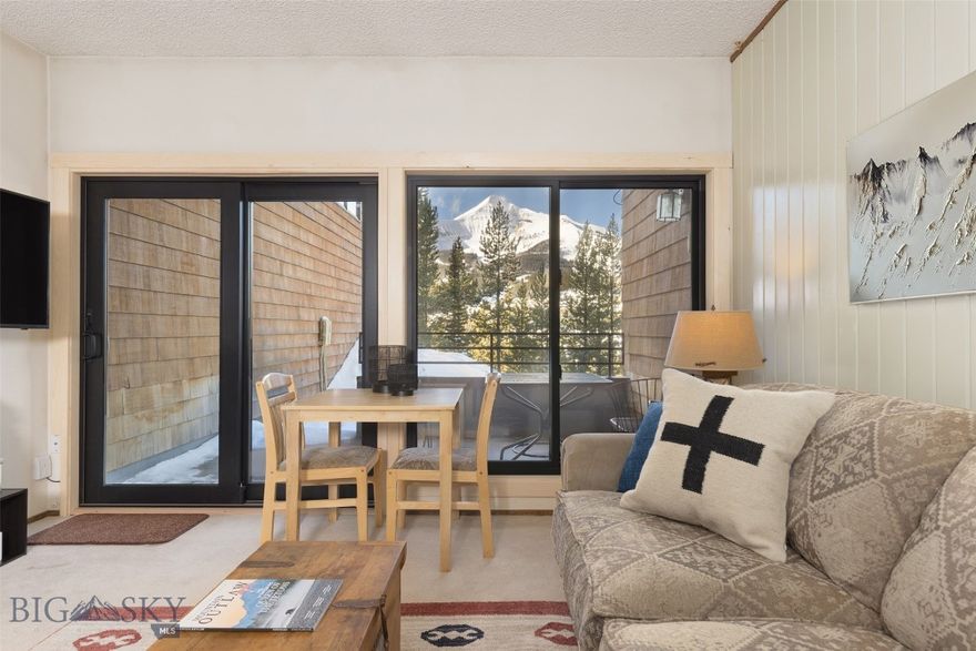 Do you dream of living above it all while still enjoying the comforts of home? Welcome to your mountain retreat in Skycrest Condos, perfectly positioned in the Mountain area of Big Sky, Montana. This impeccably maintained 1-bedroom, 1-bathroom condo offers an ideal balance of comfort, style, and unforgettable scenery.

Spanning 803 square feet, this residence delivers exceptional value with its incredible, head-on views of Lone Peak — views that simply don’t get closer to the mountain. Protected sightlines showcase Big Sky Resort and Lone Peak in all seasons, creating a breathtaking backdrop you can enjoy year-round. Brand new windows throughout enhance energy efficiency and flood the space with natural light, while beautiful, recent paint updates give the home a fresh, modern feel that perfectly complements the surrounding alpine landscape.

Inside, the inviting living space features a cozy wood-burning fireplace, ideal for unwinding after a day on the slopes, and a bright sunroom where you can take in the awe-inspiring scenery while planning your next Montana adventure. An oversized storage unit with owner lock-off provides ample space for all your mountain gear, and covered underground parking keeps your vehicle secure and snow-free.

Step outside to your private patio that opens directly onto open space — the perfect setting for soaking in the expansive views, enjoying fresh mountain air, playing in the snow, or even exploring the potential to add a hot tub to elevate your experience.

Located in the heart of Big Sky, this condo offers easy access to world-class skiing, hiking, mountain biking, and fishing, along with a vibrant selection of dining and entertainment options. Additional conveniences include remotely controlled thermostats, on-site laundry facilities for residents, and a Skyline Shuttle stop just steps away.

With strong rental potential, incredible versatility, and a location that captures the essence of Big Sky living, this Skycrest condo is a rare opportunity. Schedule your private showing today and experience firsthand why Big Sky remains one of the most sought-after mountain destinations in the world. Seller open to Seller financing.