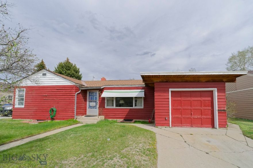 Ranch Style Home in established, desirable neighborhood.  It is so much more spacious when you step inside! Enter through the front porch or attached garage into the living room or large dining room with fireplace and extended area for seating. The dining area & kitchen and  bedroom has beamed ceiling and tongue and groove pine. A bathroom with double sinks completes the space. The kitchen has beautiful maple cabinets and navy blue countertop. The original living room space has fir floors along with fir doors. Along on this side is a single bath, 2 bedrooms and one large, beautiful primary bedroom with a large picture window and newer oak flooring. Going downstairs you will see a laundry and storage room, two workshops and large family room with large closets and a half bath. Outside the home is a large patio, greenhouse. Plumbing and electrical upgrades should be considered along with cosmetic updates.