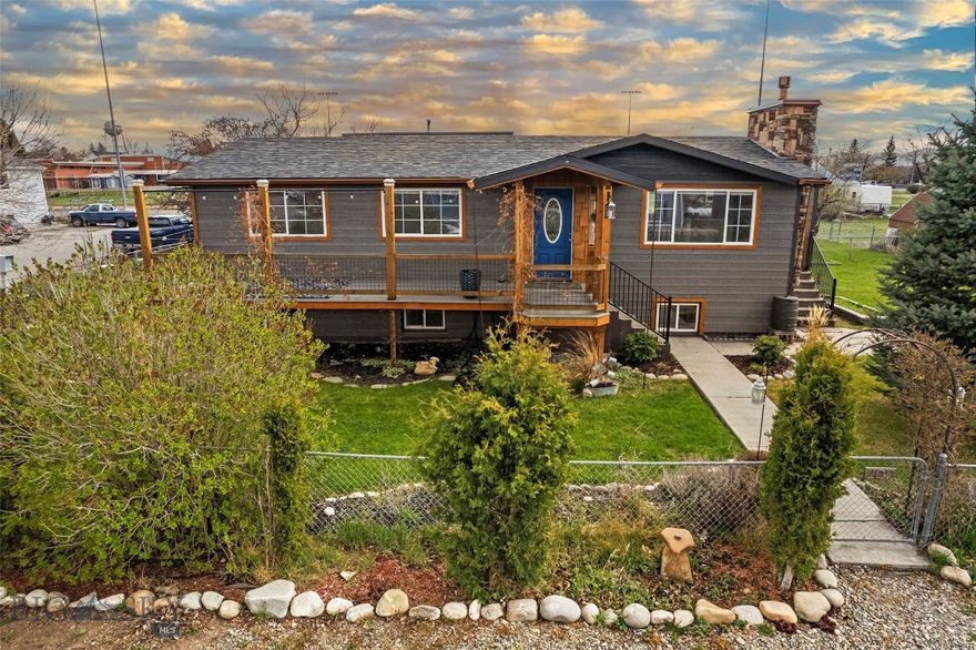 Welcome home to this thoughtfully updated raised ranch where comfort meets craftsmanship. Right from the start, the covered front porch draws you in with rustic posts and railing, and a bold blue door that makes a statement without trying too hard. Inside, the home is clean, functional, and built for everyday living. The kitchen offers ample cabinetry, stainless appliances, and durable flooring that carries into bright, open living spaces. Outside is where this property really opens up. A spacious composite deck sets the stage for gatherings, overlooking a fully fenced yard with raised garden beds, mature landscaping, and space to spread out. The stacked-stone chimney adds that Montana character buyers are always looking for. And then there’s the shop—oversized, detached, and ready for whatever you need. Storage, projects, toys… it handles it. You’ve got mountain views, easy access to town, and a low-maintenance setup that just makes sense. Clean. Updated. Move-in ready. Homes like this don’t sit long—come take a look and see it for yourself.