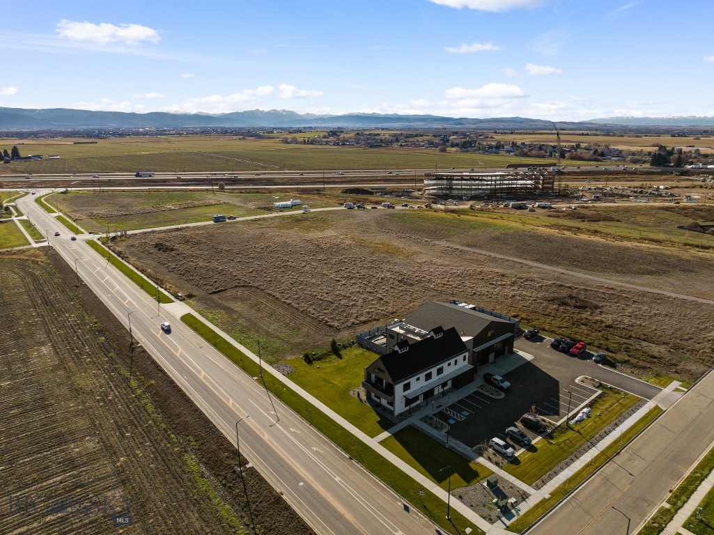 This 1.77 acre lot fronts Nelson Road providing excellent access to the Frontage Road and I-90. This property is available with building plans for an approximate 25,300 SF building (17,700 SF of light industrial with 7,600 SF of office). Located in Nelson Meadows...a new 27-lot commercial subdivision that features great visibility from I-90 and the Frontage Road just west of the 19th Ave interchange. Nelson Meadows is a new, master planned commercial subdivision zoned M-1 in the City of Bozeman with city water and sewer, natural gas and heavy power. Located off Frontage Road, this has I-90 frontage and is easily accessible from the City of Bozeman and Belgrade. interchange and would be ideal for manufacturing, warehousing, distribution, shipping and receiving, etc.