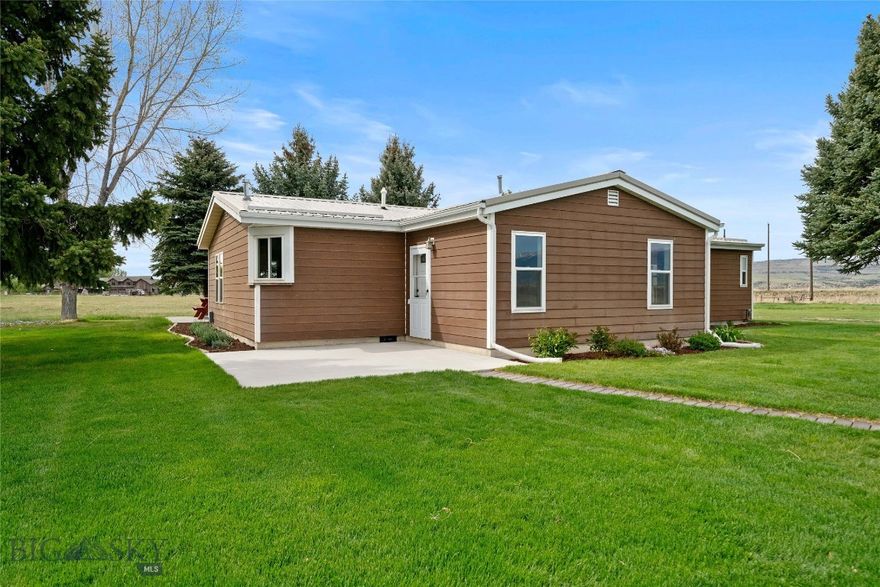 Set on 4.89 fenced acres (bring your horses) with expansive Bridger Mountains views, this 3-bedroom, 2-bath home offers 1,808 square feet of comfortable living space with room to spread out both inside and out. A flexible bonus room is ideal for a home office, hobby space, or playroom. The home features new flooring throughout, updated appliances, remodeled bathrooms, and a spacious primary bath with a granite countertop and a soaking tub.
Enjoy multiple gathering spaces including a cozy reading room with a wood-burning and a gas burning stove off the living room added warmth and character. Central A/C provides year-round comfort. Outside, mature trees, front and back patios, and a setting tucked well off the road create a quiet rural atmosphere with open views in every direction.
The large approximately 49’ x 28’ shop/garage provides excellent space for projects, storage, vehicles, trailers, campers, and recreational equipment. You can also park trailers, campers and toys outside. Perimeter fencing and open acreage offer flexibility for a variety of uses. Private well. Surrounded by open farmland and wide-open skies, this property delivers the space and peaceful setting many buyers are looking for.