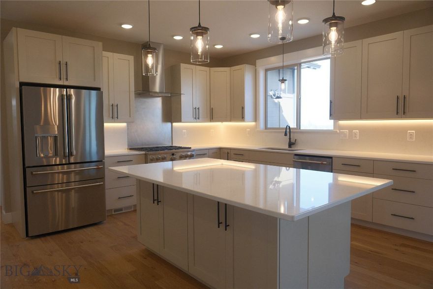 Another exquisite new construction by Graham Enterprises Inc in the desirable White Horse Ranch subdivision. Building residential homes in the Gallatin Valley for over 30 years, GEI is known for its quality construction, functional design, and exceptional customer service. The White Horse Ranch subdivision is one of Bozeman's premier neighborhoods offering large lots, beautiful views, serene setting, walking trails, community basketball and pickle ball courts plus a gazebo, all minutes from downtown Bozeman. Amenities in this home include solid white oak sand and finish hardwood floors, quartz countertops throughout, GE Cafe stainless appliances, whole house humidifier, almost 500SF of bonus room space, and a large three car garage. Yard will be fully landscaped. Estimated completion date 4/9/26