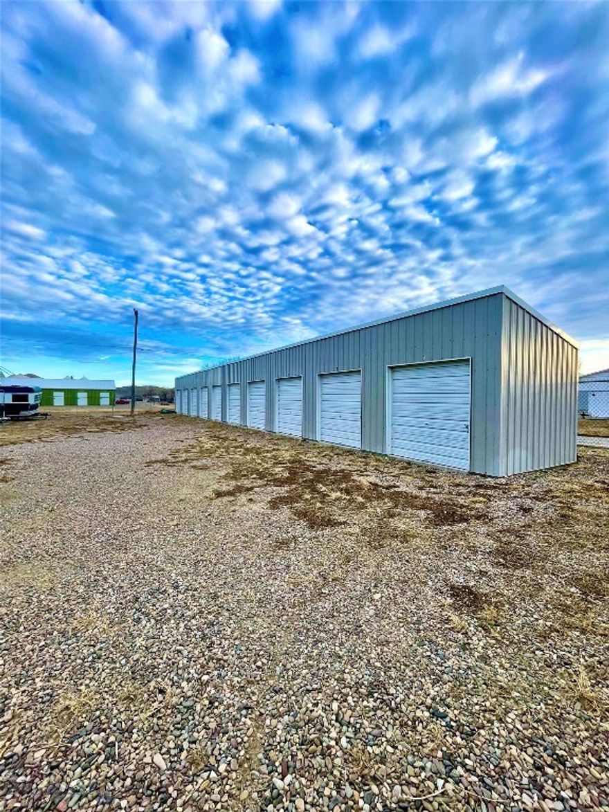 Here’s your chance to step into commercial real estate with a simple, proven, income-producing asset in Fort Benton, Montana. This 0.964± acre fenced property includes 10 storage units, 6 grain bins, and an 18’ x 45’ storage building creating multiple streams of revenue right from day one. Current rates show strong potential, with storage units renting at $60/month and grain bins generating approximately $19,000/year. The best part? There’s room to grow. With nearly an acre of usable land, this property offers the opportunity to add more storage units, increase monthly income, and build long-term equity over time. Whether you’re a first-time investor looking for your first cash-flowing property or someone ready to expand a portfolio, this is the kind of asset that’s easy to understand, easy to manage, and built for steady demand in an agricultural community.