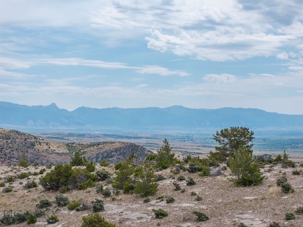 This 20 acre parcel in the scenic Gallatin River Ranch community offers breathtaking mountain vistas, and gentle rolling prairies. The property provides an ideal, easy-build site with minimal common area and power readily available. Create your dream home with ample room for a guest house, shop, barn and even some horses. Exclusive neighborhood amenities include 2.5 miles of private Gallatin River access perfect for fishing, floating and relaxing by the water. The private river access includes a boat launch, a walk-out riverside picnic area with a gazebo, BBQs, and a fire pit. The Ranch also boasts a world-class equestrian center complete with indoor and outdoor arenas and boarding. Enjoy over 1,600 miles of hiking and horseback riding trails plus access to 640 acres of state land. The Ranch is also home to an abundance of wildlife. Experience unparalleled tranquility just outside charming Manhattan, only 25 minutes from the airport, and a short 35-minute drive to Bozeman, with its fine dining, entertainment, and shopping.
Possible Seller financing available. Some photos showcase the entire ranch.
(Photo with home is AI generated, no home is on the lot)