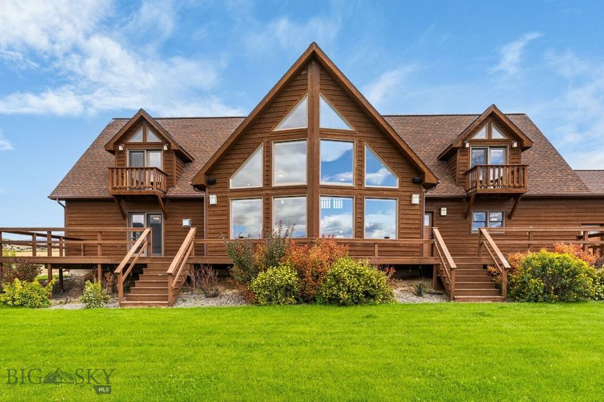 This custom-built residence offers over 3,500 square feet of thoughtfully designed living space on just over 5 acres with irrigation water and hand lines. The beautifully landscaped grounds feature a manicured lawn with an underground sprinkler system and a large deck extending along two sides of the home, ideal for enjoying the surrounding views of the Ruby Mountains. Inside, the home includes 4 bedrooms, with one well-suited for use as an office. The primary suite offers a walk-in closet, bathroom with a jetted tub, and private deck access to the hot tub. Two additional upstairs bedrooms are generously sized, each with large closets and private balconies. The formal dining room provides direct access to the deck, creating excellent space for gathering and entertaining. The kitchen is equipped with granite countertops, stainless steel appliances, and abundant cabinetry. The main living area showcases vaulted ceilings, expansive windows that frame the mountain views, and a gas fireplace. Additional features include central air conditioning, central vacuum, and a landscaped yard with underground sprinklers. This property combines comfort, functionality, and scenic beauty with ample space both indoors and outdoors.