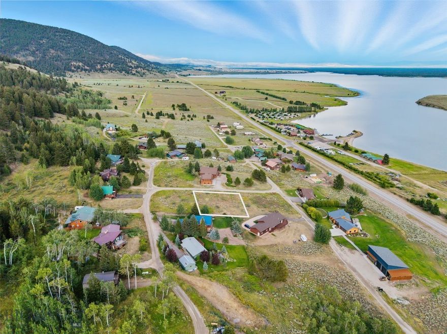 Welcome to your future home site in the coveted Yellowstone Holiday subdivision on the shores of Lake Hebgen, just minutes from the west entrance of Yellowstone National Park. This exceptional lot offers stunning lake views, a peaceful setting, and a strong sense of community with friendly neighbors nearby.

Whether you're envisioning a cozy cabin retreat and winter snowmobiling or a custom year-round residence, this property provides the perfect backdrop—where morning coffee comes with sunrise reflections off the water and evenings end with alpenglow over the mountains. With a full-service marina just across the street, you are just a stone’s throw from fishing or boating. Big Sky Resort and world class skiing are only one hour away. The lot has electric to the lot and a community water system and is ready for your build.