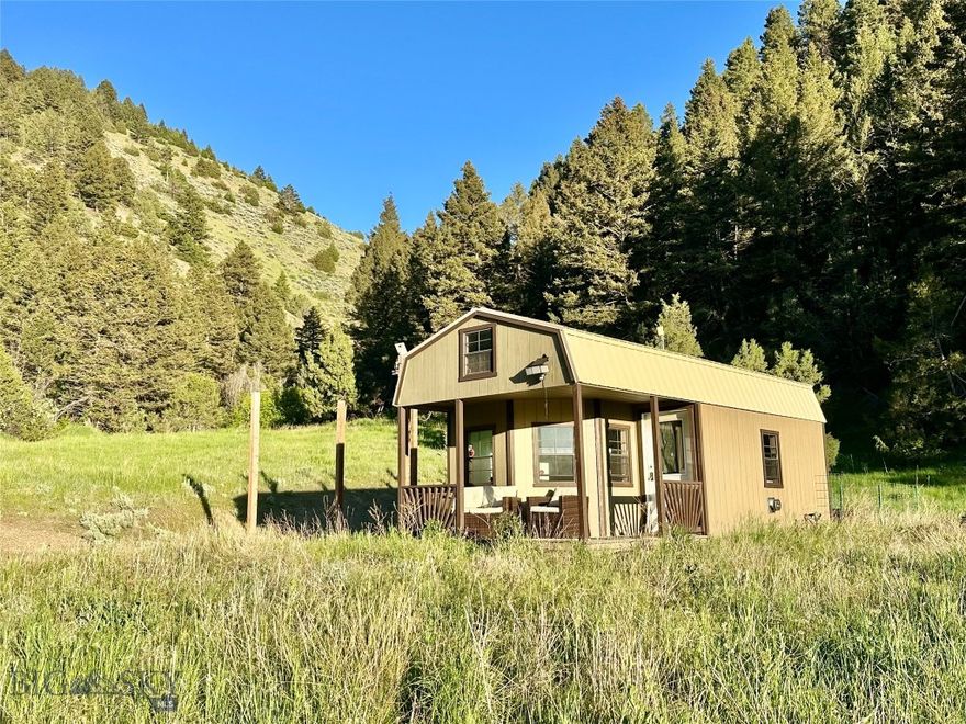 60 ACRES near Bozeman, Montana. Enjoy this OFF-GRID CABIN for recreation, or live here and build your Montana dream home. The acreage is mostly wooded, providing excellent wild life habit and privacy to hike and relax in nature. Cute pre-fab cabin sells furnished with indoor and outdoor furniture, appliances, and a wood stove heater. Off-grid system with solar arrays, batteries, a water holding tank (propane tank is leased) convey. The cabin is already prepped for a composting toilet. There is a nice covered porch to enjoy the views and an existing RV pad. Have fun on the jeep trail runs up the hill to the upper elevations of the lots. There is a DEVELOPED SPRING located on the neighbors lot with water rights and a recorded easement in place.  There are four separately deeded lots (two 10 acre tracts and two 20 acre tracts). Year round access with 4x4 as needed. The west side of the Clarkston community borders public land and the Missouri River, so outdoor recreation is nearby. Area attractions include Headwaters State Park & Buffalo Jump State Park and the Gallatin, Madison and Missouri Rivers offer fishing and floating fun. The local towns of Three Forks and Manhattan are ~25 miles and Bozeman is ~45 miles.