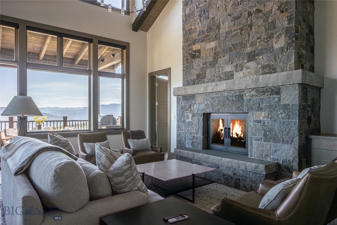 Stunningly appointed 5-bedroom, 6 bath ( 1 full, 5 3/4 ) Inspiration Point unit at Spanish Peaks Mountain Club. An end unit in a prime location, this unit is furnished to sleep up to 10 and features floor-to-ceiling windows that provide amazing views of the Spanish Peaks, the Gallatin Range, and back to Lone Peak. Not a detail is missed: gourmet kitchen with Wolf and Sub-Zero appliances, wood floors, 3 fireplaces, a large main level deck with a gas firepit, ample seating and gas grill, and a lower level patio with a hot tub. The Main level features the master suite with a gas fireplace, a large ensuite bathroom with a tub and a separate steam shower, and a walk-in closet with built-ins.
The lower level features 3 ensuite bedrooms, a family room with a wet bar and gas fireplace, a large theatre room with seating for 6, a laundry room, and a second powder room. All bedrooms have access to the outdoor hot tub and patio.
A Signature Golf membership is available with this property, granting access to the clubhouse with dining, bar, golf/ski lockers, direct slope-side access to Big Sky, and preferred privileges at the nearby Montage Hotel. Membership application and approval, and membership deposit are required no later than closing.